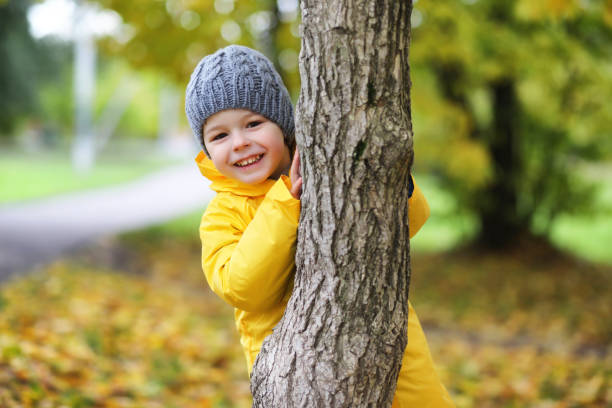 istock Children in the autumn park walk 877174666