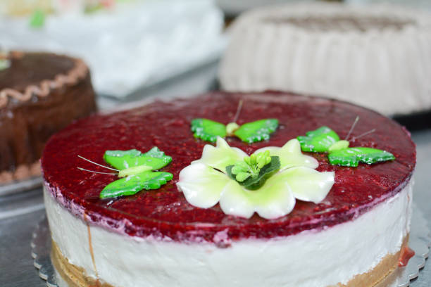 istock Cheese cake whit green butterfly 877177334
