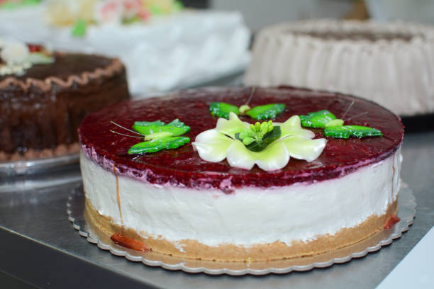 istock Cheese cake whit green butterfly 877177554