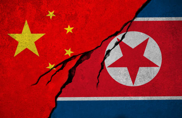 istock Chinese and North Korean flag, conflict concept 877180618