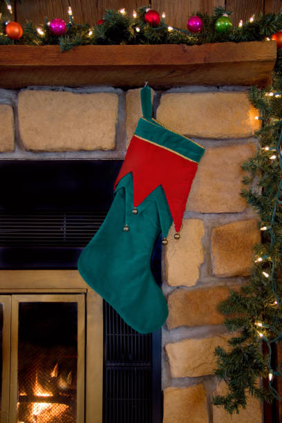 istock Christmas Green Stocking Hanging on Fireplace 877181328