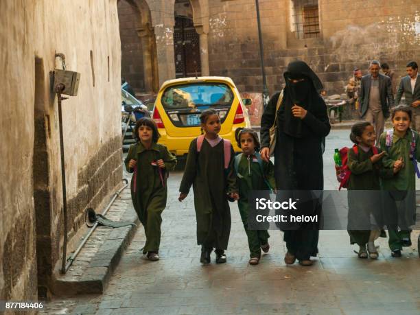 Woman In Black Dress With Small Children Stock Photo - Download Image Now - Yemen, Women, People