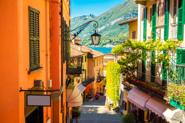 Picturesque and colorful old town street in Bellagio city in Italy Picturesque and colorful old town street in Bellagio city, Italy como italy photos stock pictures, royalty-free photos & images
