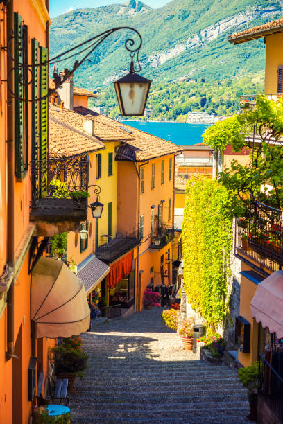 Beautiful street in Bellagio city in Italy Picturesque and colorful old town street in Bellagio city, Italy italian lake district photos stock pictures, royalty-free photos & images