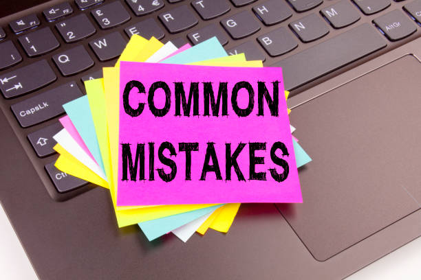 istock Writing Common Mistakes text made in the office close-up on laptop computer keyboard. Business concept for Common Decision Mistakes Workshop on the black background with copy space 877188374
