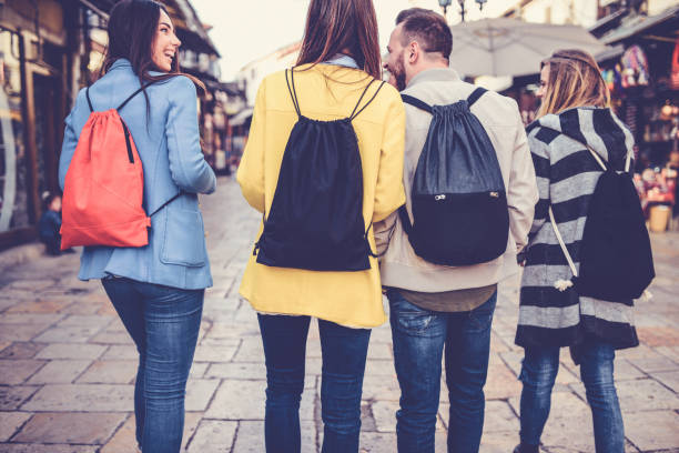 istock Group of Students with Backpacks Walking After School 877193388