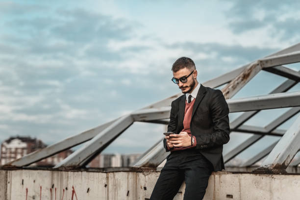 istock Man in his suit with sunglassess 877194636