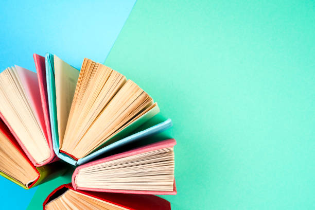 top view of bright colorful hardback books in a circle. - brown paper imagens e fotografias de stock