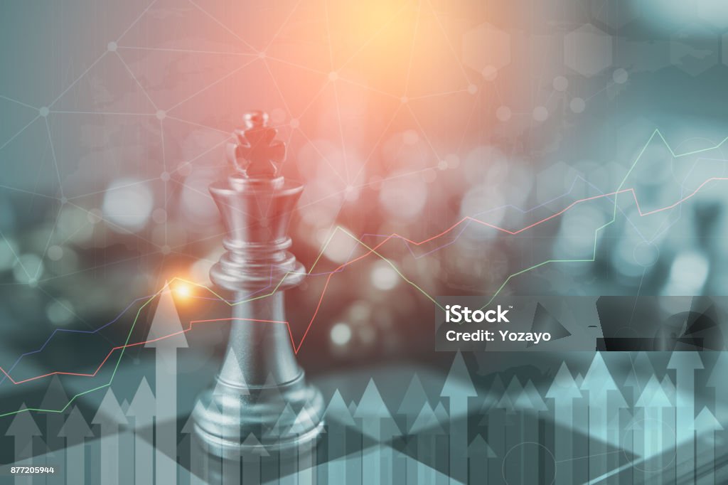 Investment Leadership Concept : The king chess piece with chess others nearby go down from floating board game concept of business ideas and competition and strategy plan success meaning, Strategy Stock Photo