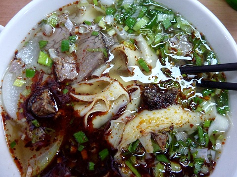 Warm plate of famous Lanzhou lamian beef noodles, the premiere local dish in Lanzhou, the capital city of Gansu province, China