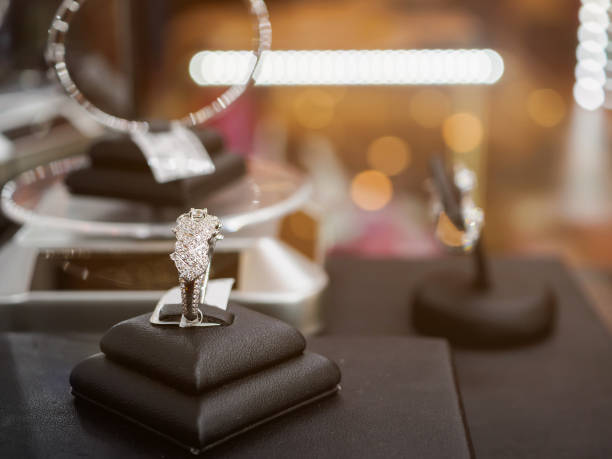 istock Diamond rings in jewelry luxury store window display 877219728