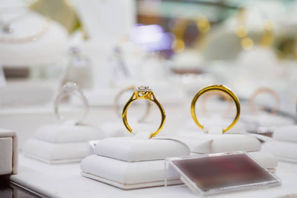 istock Diamond rings in jewelry luxury store window display 877219736