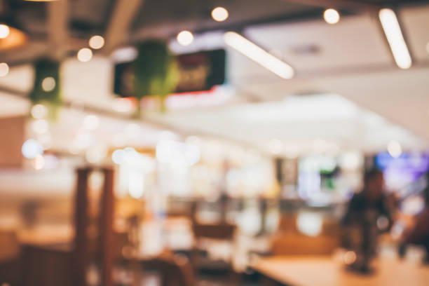 istock Restaurant cafe or coffee shop interior with people abstract blur background 877220342