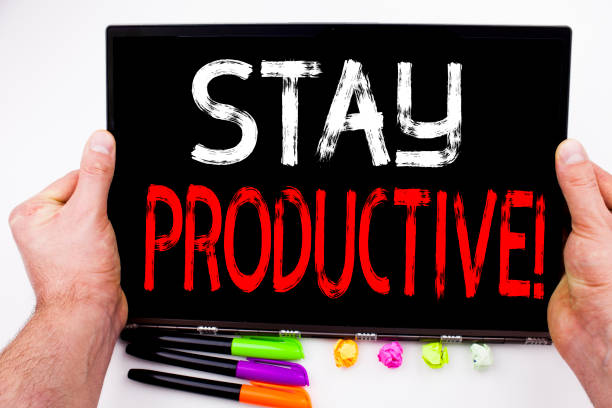 istock Stay Productive text written on tablet, computer in the office with marker, pen, stationery. Business concept for Concentration Efficiency Productivity white background with copy space 877223062