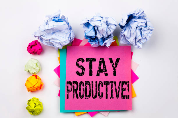istock Writing text showing Stay Productive written on sticky note in office with screw paper balls. Business concept for Concentration Efficiency Productivity on the white isolated background. 877223086