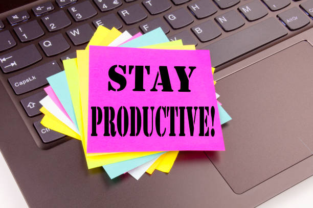 istock Writing Stay Productive text made in office close-up on laptop computer keyboard. Business concept for Concentration Efficiency Productivity Workshop on the black background with copy space 877223216