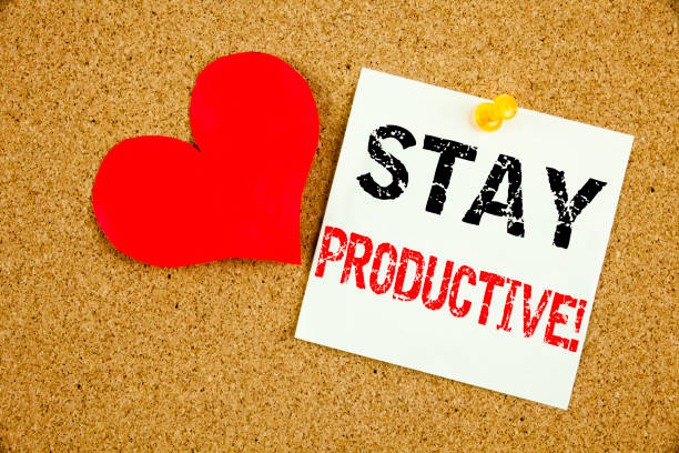 istock Conceptual hand writing text caption inspiration showing Stay Productive concept for Concentration Efficiency Productivity and Love written on sticky note reminder cork background copy space 877223294