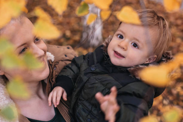istock Mother playing with her cute little son 877223644
