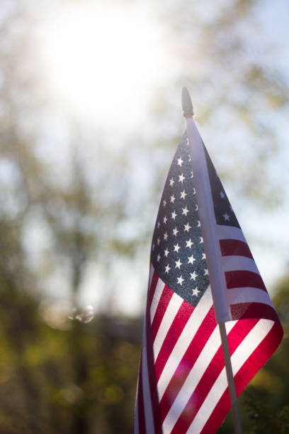 istock US Flag and Sun Beam, Close-Up 877224048