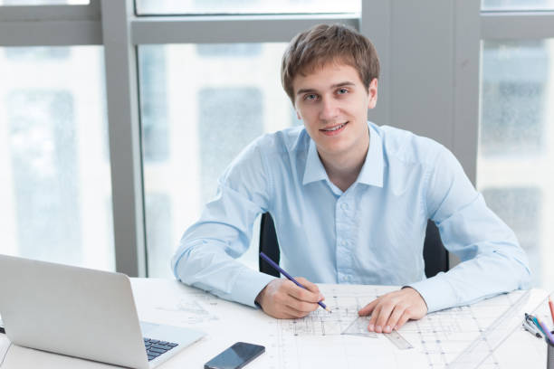 istock young white man technician works in modern office 877227820