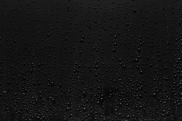 istock Water droplets on black background 877231552