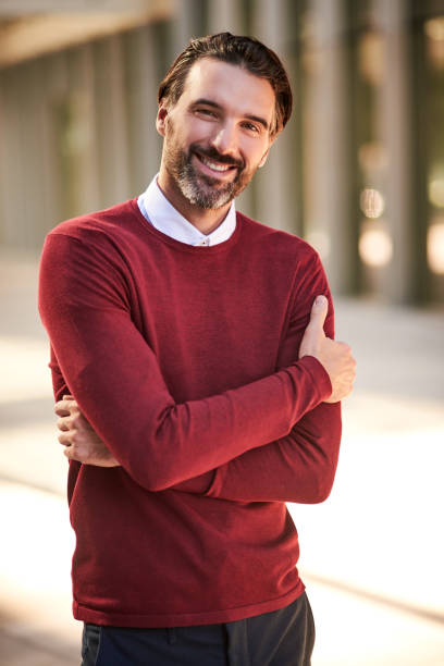 istock Portrait of a handsome smiling man 877231872