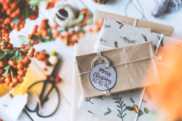 istock Christmas gift box stack on wooden table, merry christmas 877232340