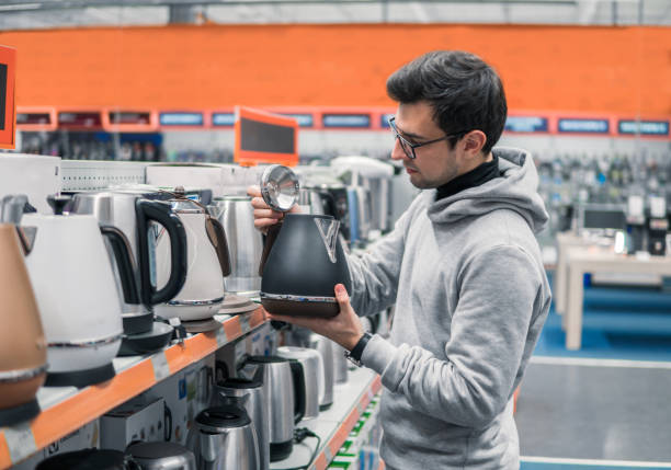istock customer chooses a kettle in supermarket mall 877238518