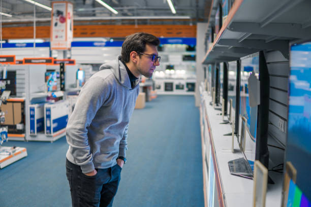 istock customer choosing large fridges in domestic appliances section 877238912