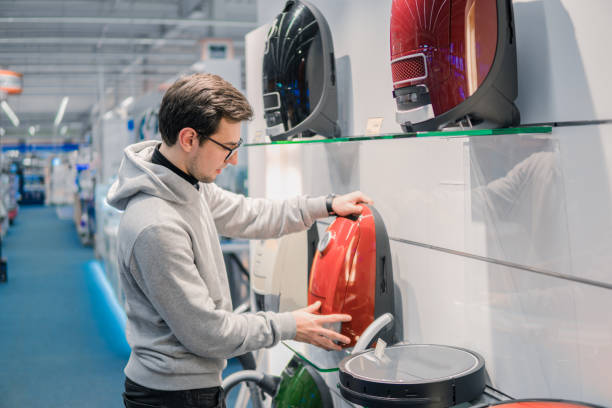 istock Smart customer buying new vacuum cleaner. 877238924