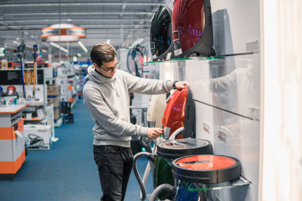 istock Smart customer buying new vacuum cleaner. 877238950