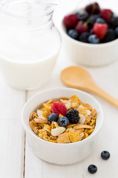 istock Cereal with milk and wooden spoon 877247722