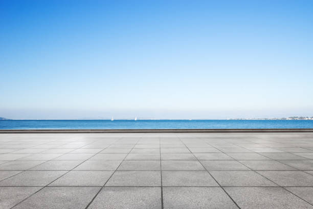 istock empty marble floor and blue sea in blue cloud sky 877250544