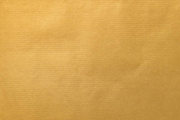 istock Golden kraft paper texture for gift wrapping 877260562