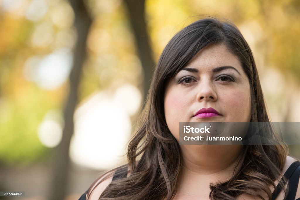 Mid adult woman Mid adult lesbian woman looking at the camera Overweight Stock Photo