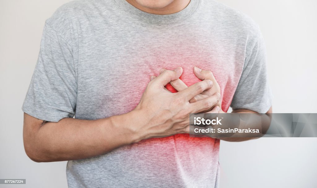 a man touching his heart, with red highlight of heart attack, heart failure and others heart disease Heart Disease Stock Photo