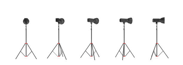istock 3d rendering of three lights with reflectors with the head turned down and up. 877269380