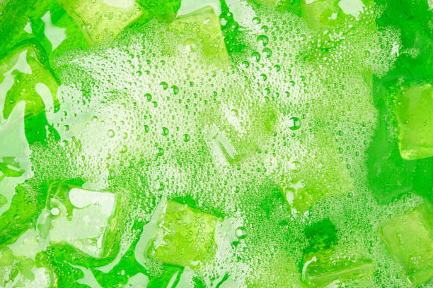 istock Green soda water cold drink fruit with ice and bubble for background design 877270368