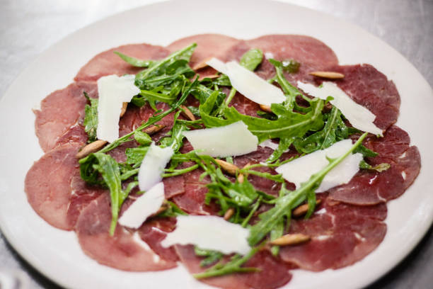 Beef Carpaccio Italian Style Beef Carpaccio carpaccio parmesan cheese beef raw stock pictures, royalty-free photos & images