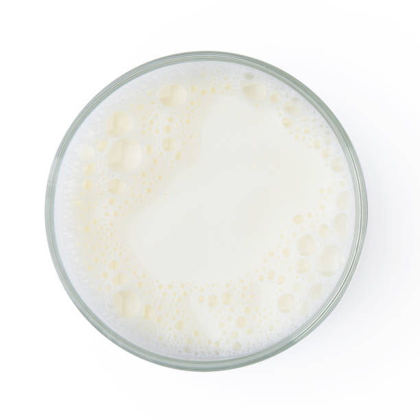 istock Cup with milk bubble foam isolated on white background top view texture object design 877273514