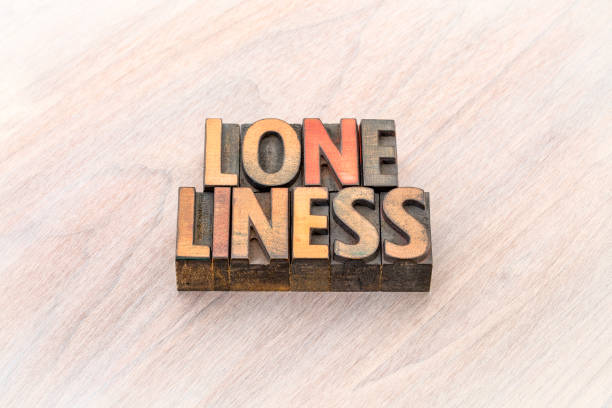 istock loneliness word abstract in wood type 877281560