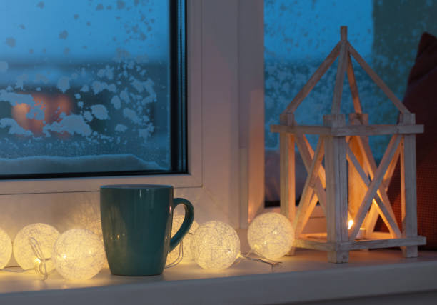 istock winter decor with candles and garland 877281640