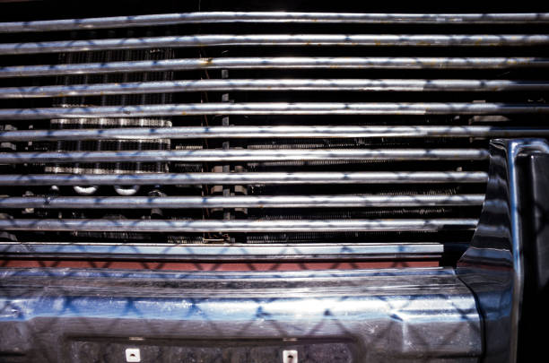 Front of the car and fence.