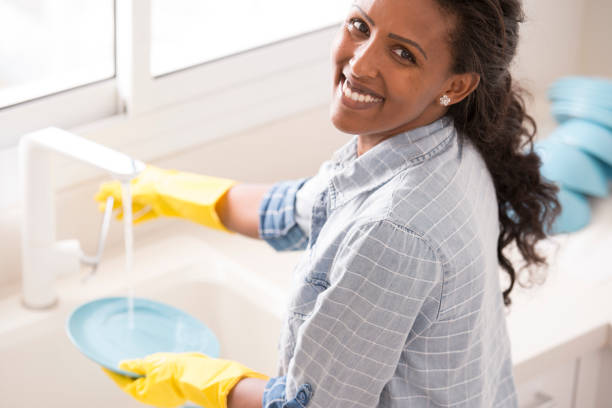 istock Woman doing house chores. 877290402