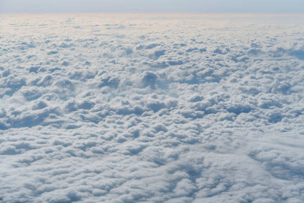 istock cloud in the sky, Looking to the window in the airplane. 877300590