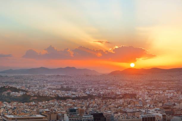 istock Athens skyline sunset from Mt Lykavitos 877300598