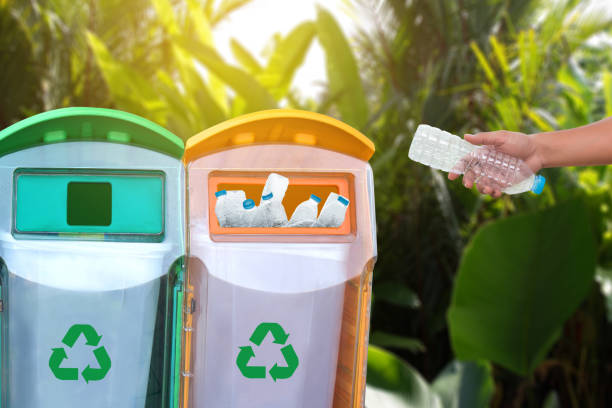 istock man hand putting plastic reuse  for recycling concept environmental protection world recycle 877301030