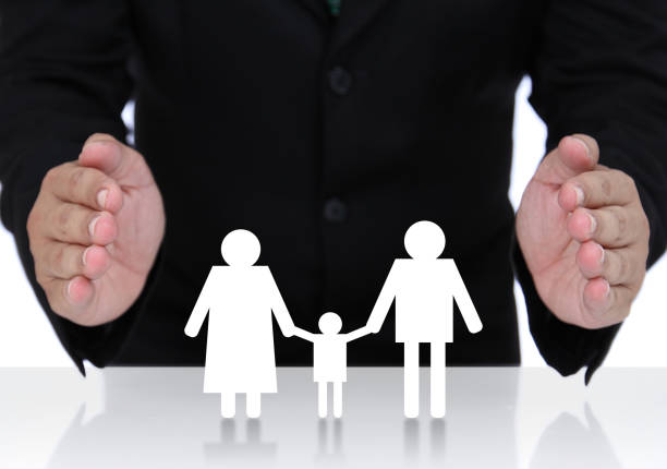 istock Businessman hand protect  family 877302038