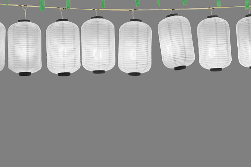 Japanese lanterns on gray background.