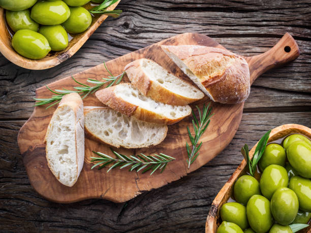 istock Slices of ciabatta with rosemary herb. 877307548